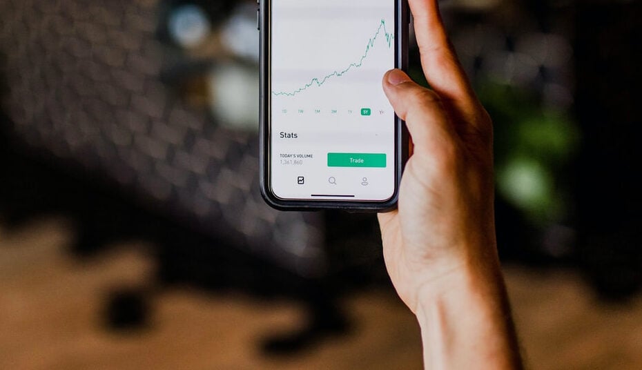 An investor views a stock chart on a mobile device