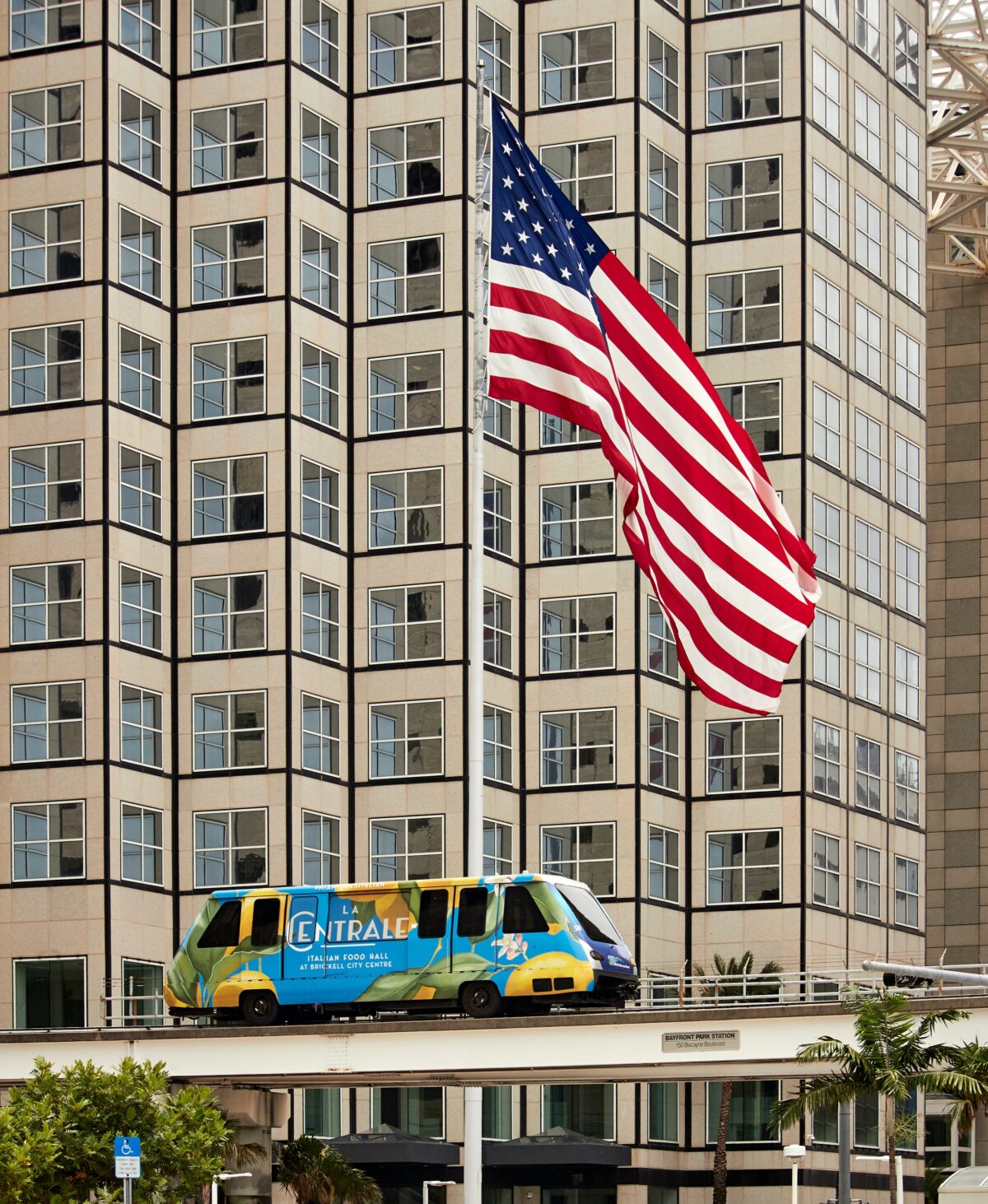 American flag over luxury apartments