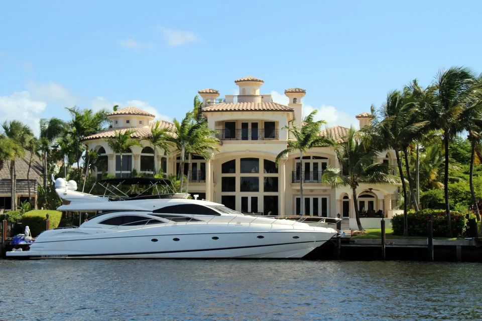 Huge yacht in front of a mansion