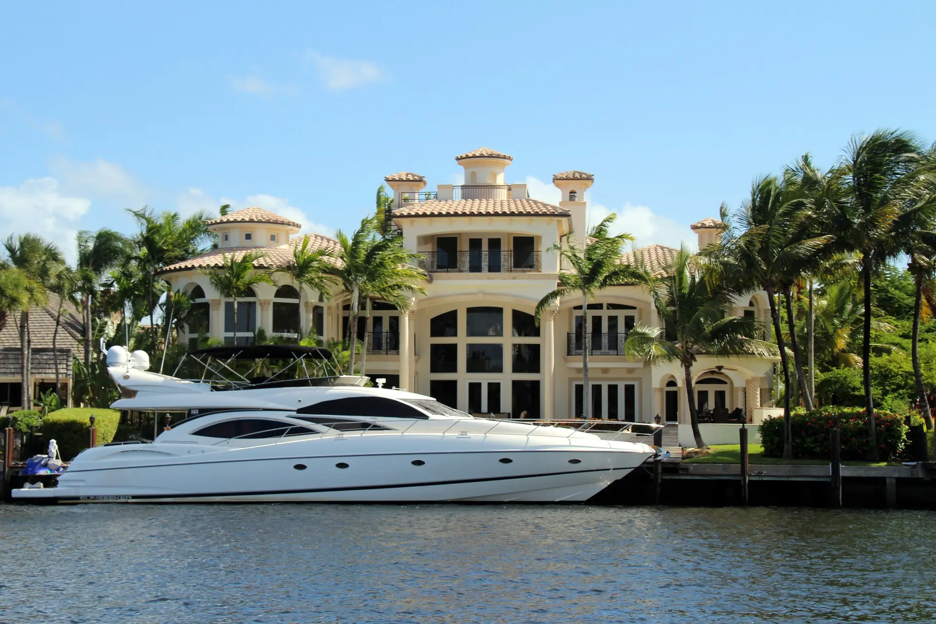 Huge yacht in front of a mansion