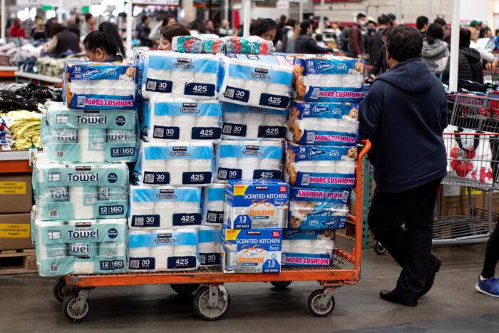 man buying toilet paper in bulk