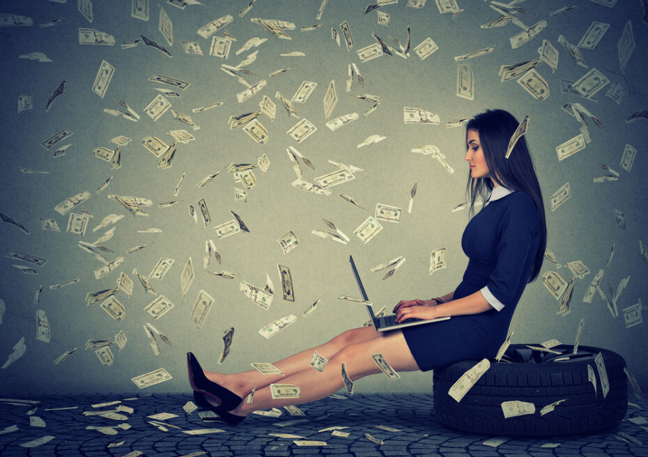 woman surrounded by flying money