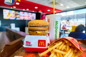 A McDonald's Big Mac with french fries on display in a McDonald's fast food restaurant