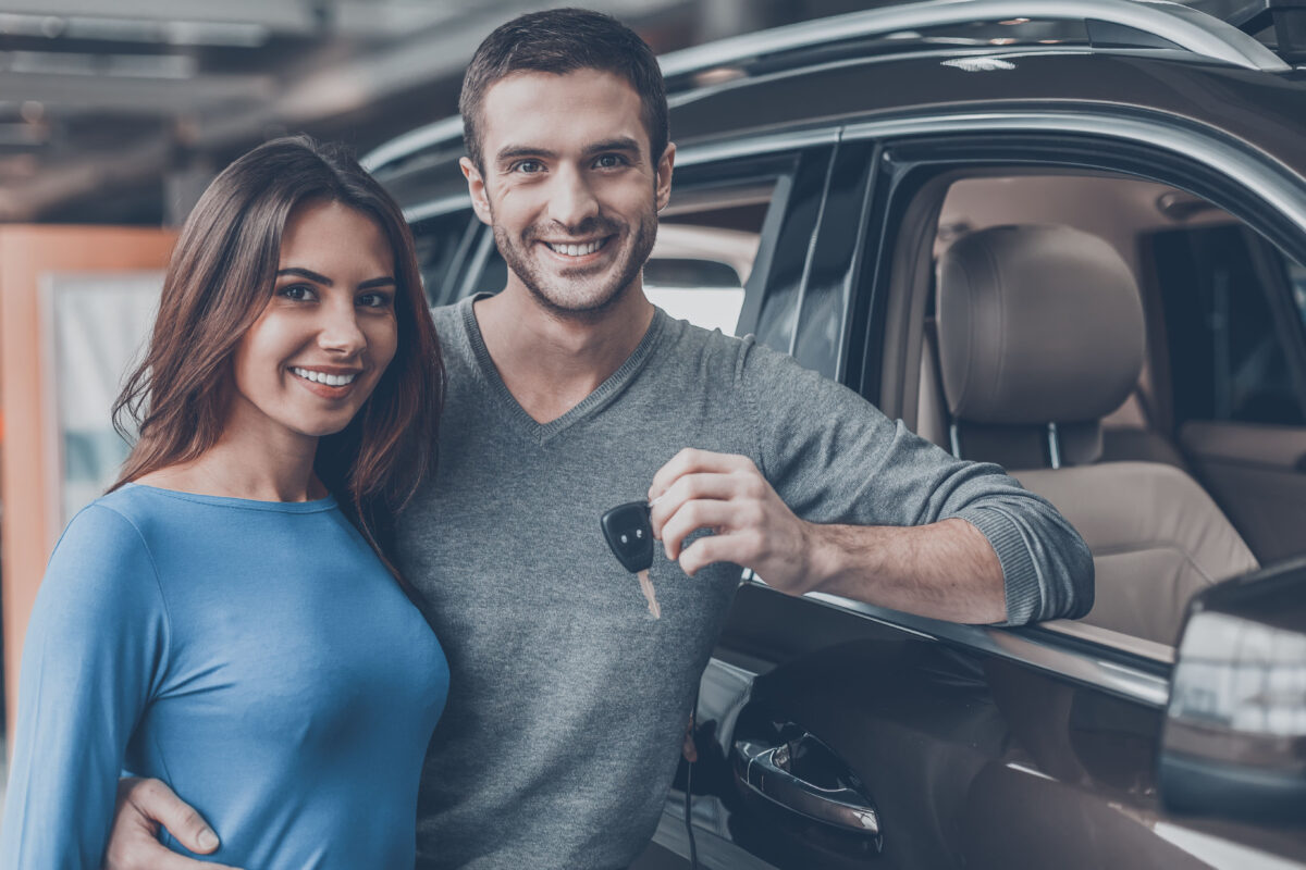 couple buys new car