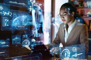Woman doing computer work, surrounded by digital artificial intelligence signals