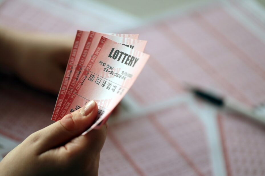 Person holding a lottery ticket