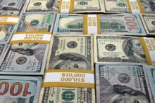 Stacks of hundred dollar bills laying out