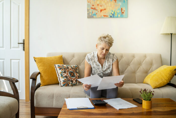 A woman looking at her documents