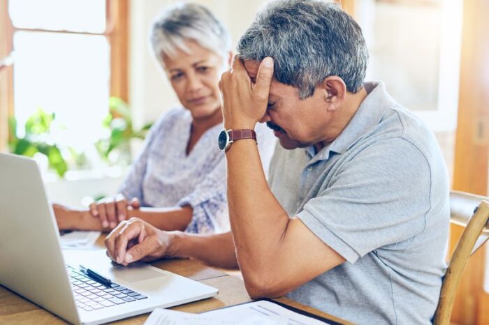 Two people stressed over debt