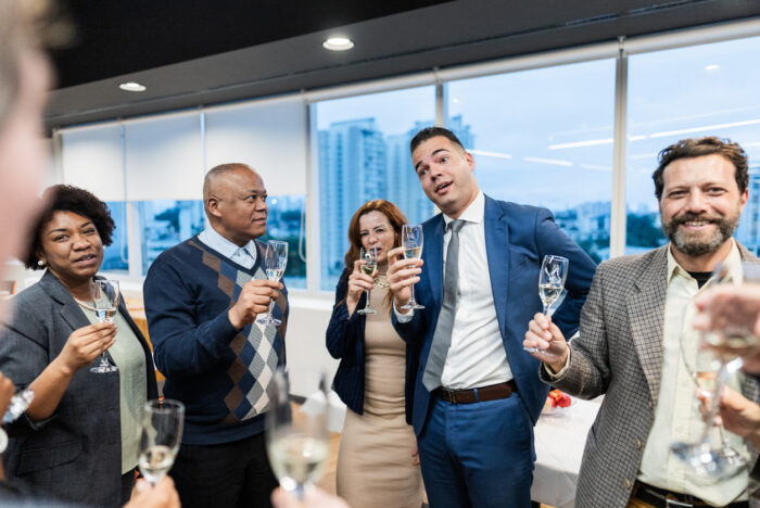 Coworkers together during celebration in the office