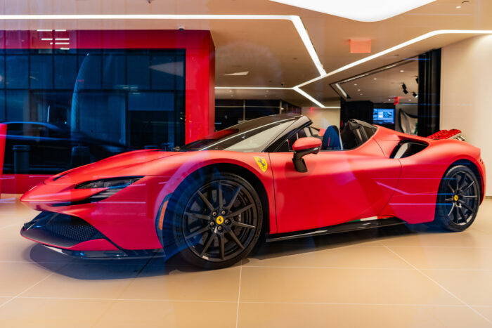 New York City, USA - August 09, 2023: Ferrari SF90 Stradale supercar sports car in showroom, low corner view.