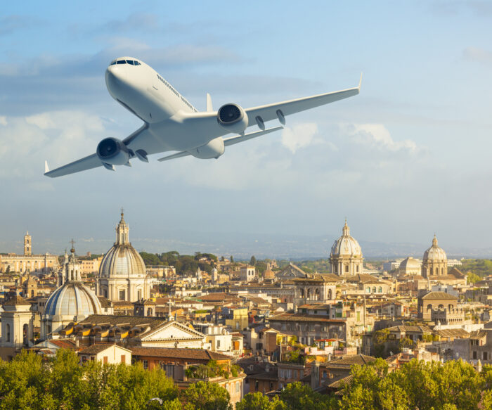 Airlpane over cityscape of Rome, Italy.