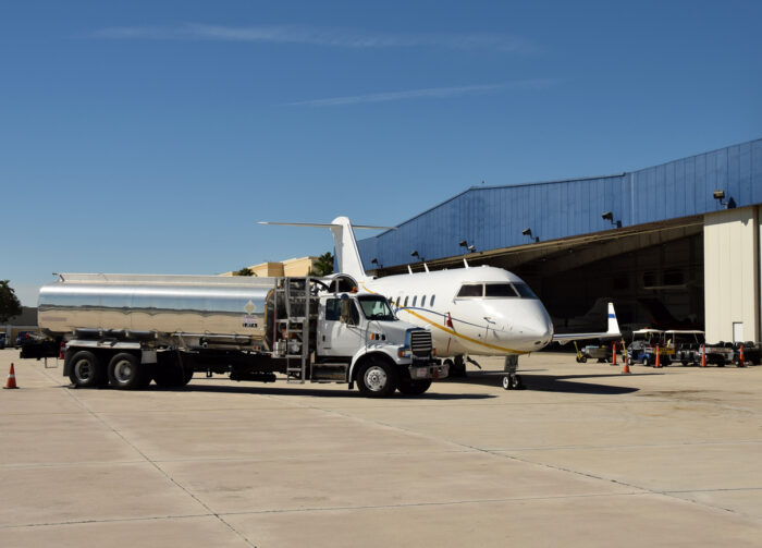 Private luxury jet receives fuel service before flight