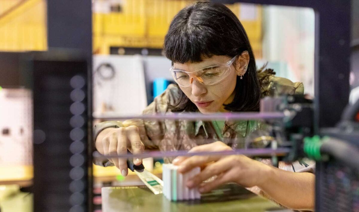 Woman using a 3d printer