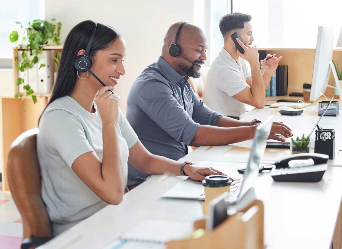 Call center with two men and a woman