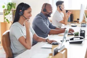 Call center with two men and a woman