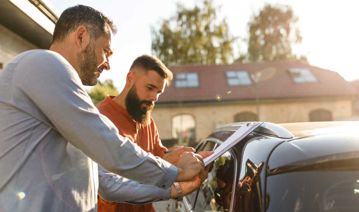 Man selling a car to another man