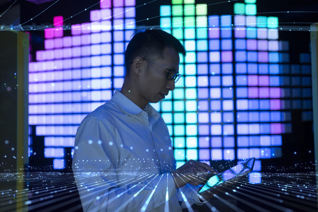 Asian Men Work on Tablets