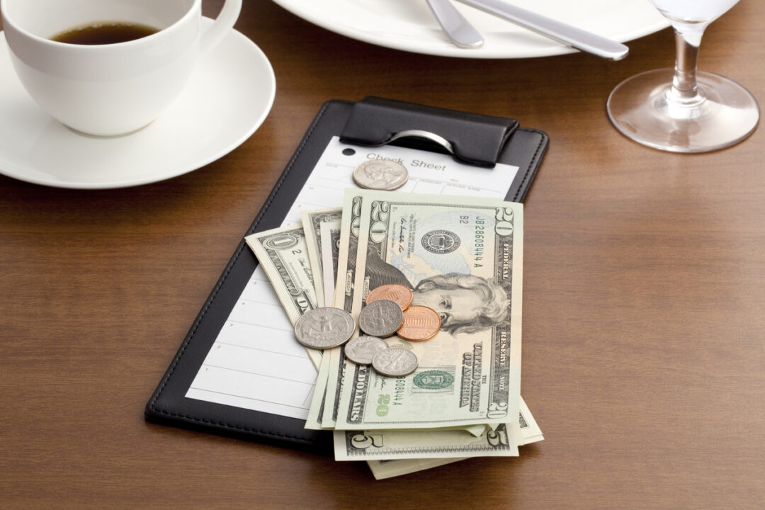 Guest check with Cash and Coin on white background