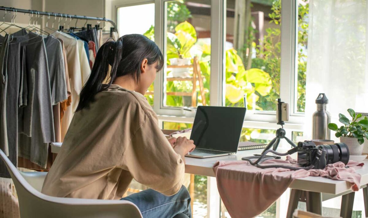 Woman sitting at her computer at home