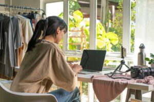 Woman sitting at her computer at home