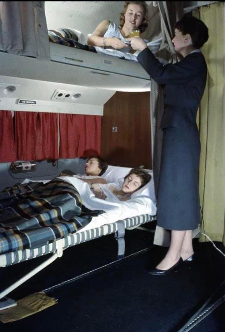 Passenger enjoying breakfast in bed on a KLM flight 1950s