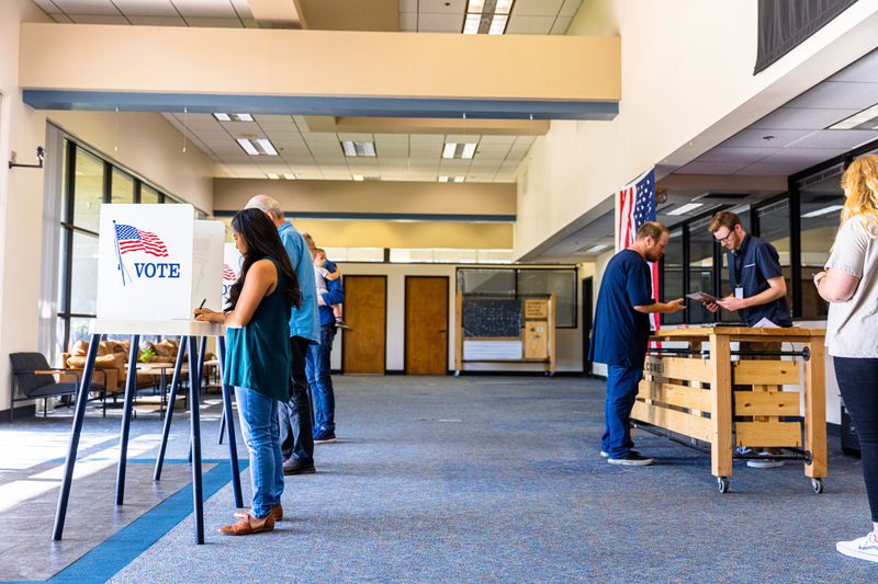 Americans in a voting booth