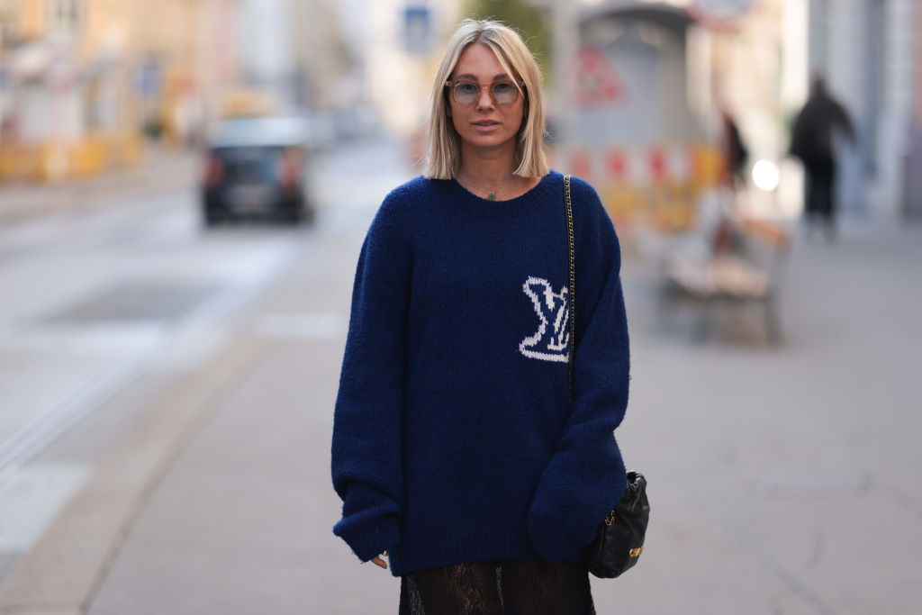 woman wearing LV sweater