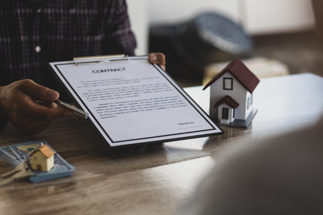 Real estate agents are discussing the terms of signing contracts, legal agreements, land purchases, mortgages and home rentals.