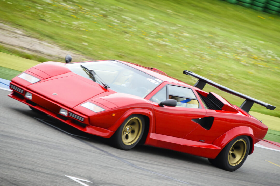 Assen, The Netherlands - May 19, 2013: Red Lamborghini Countach super car driving on the race track during the 2013 Viva Italia event at the Assen TT circuit.