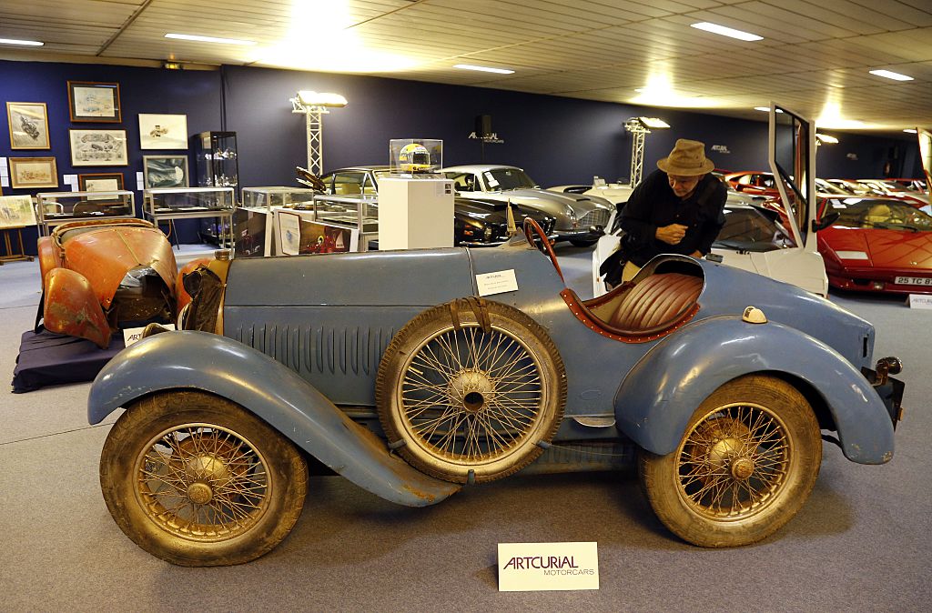 A man looks at a Bugatti Type 13 "Brescia", circa 1925, on display at the Artcurial auction house in Paris on June 20, 2015. The cars will be auctioned off on June 22, during the 8th edition of the sale entitled "Automobiles Sur Les Champs". AFP PHOTO / FRANCOIS GUILLOT        (Photo credit should read FRANCOIS GUILLOT/AFP via Getty Images)