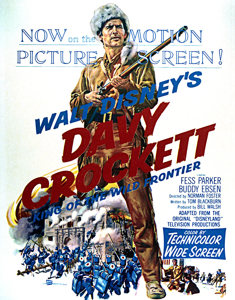 Vintage poster for Walt Disney's "Davy Crockett: King of the Wild Frontier." Features a man in frontier attire holding a rifle, with battle scenes and text promoting the film.