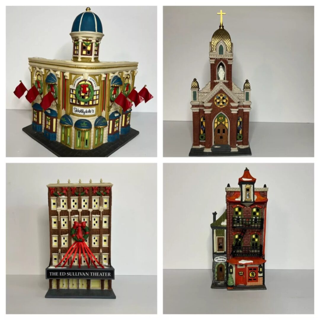 Four miniature building models displayed: a dome-topped shop with red awnings, a brick church with a gold cross, a theater with a red marquee, and a tall, narrow townhouse with varied roof lines.