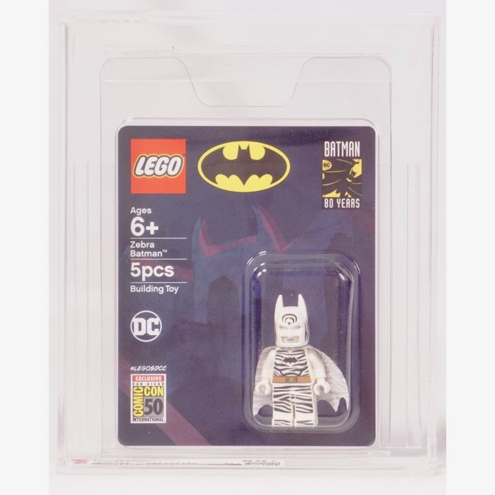 LEGO Zebra Batman minifigure in a clear display box. The packaging shows a Batman logo and says "80 Years." The toy consists of 5 pieces and is for ages 6 and up.