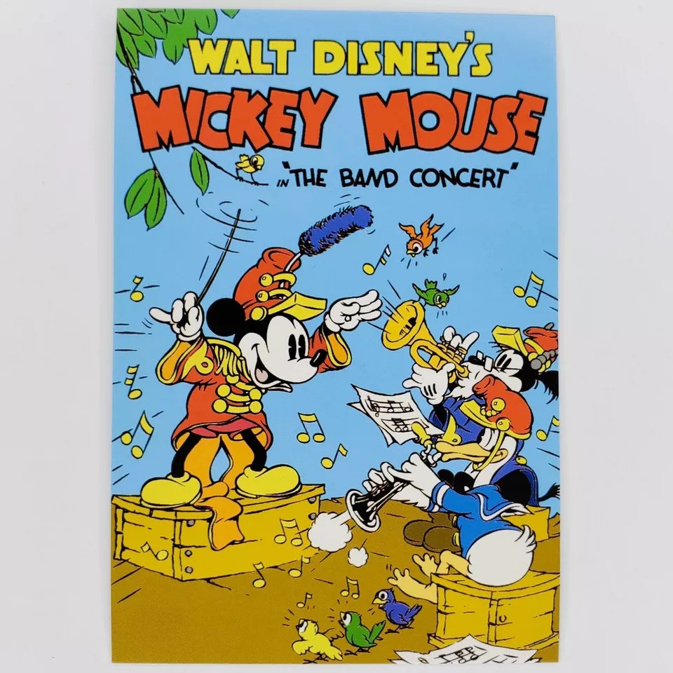 A colorful retro comic book cover featuring Mickey Mouse as a band conductor. He stands on a box, baton in hand, surrounded by Donald Duck and Goofy playing musical instruments. Vibrant notes and text bubble fill the background.