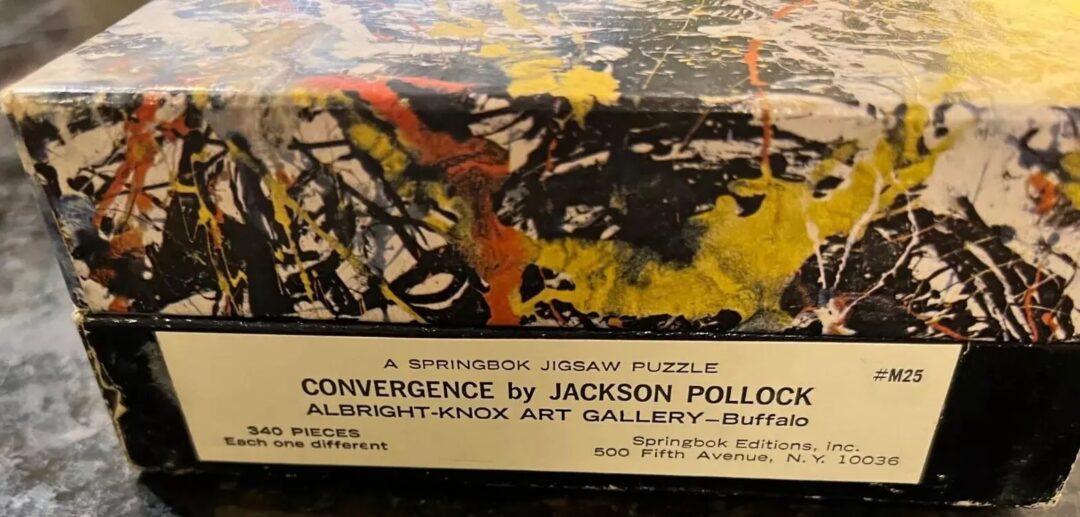 A jigsaw puzzle box labeled "Convergence" by Jackson Pollock, featuring abstract art. It states "Albright-Knox Art Gallery - Buffalo" with 340 pieces. The box has a splattered, colorful design typical of Pollock’s style.