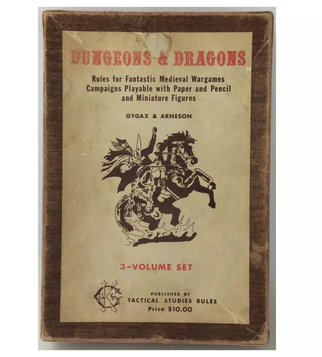 Cover of a vintage Dungeons & Dragons rulebook box set. The text reads "Dungeons & Dragons: Rules for Fantastic Medieval Wargames" by Gygax & Arneson, in a 3-volume set. Illustrated with a knight riding a horse. Price: $10.00.