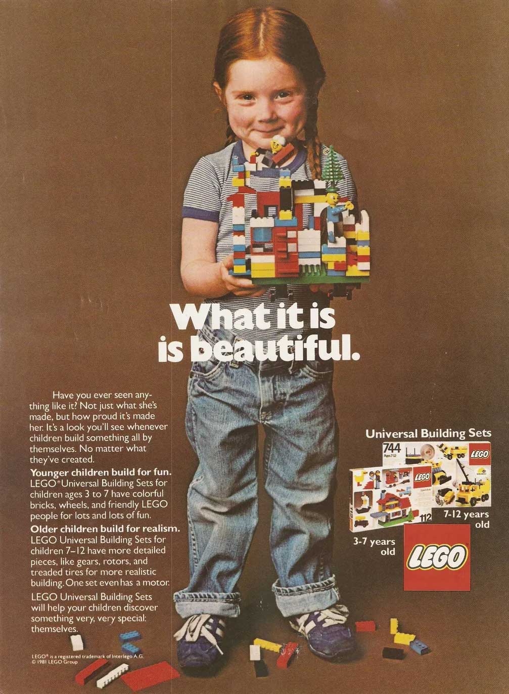 A young child with red hair, wearing jeans and a striped shirt, stands smiling and holding a colorful LEGO creation. LEGO bricks are scattered at their feet. Text on the image promotes LEGO Universal Building Sets.