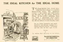 A vintage ad shows a woman using an all-gas kitchen with an oven and kettle. The room has shelves, cupboards, and various gas-powered appliances, promoting the efficiency of gas kitchens for modern homes.
