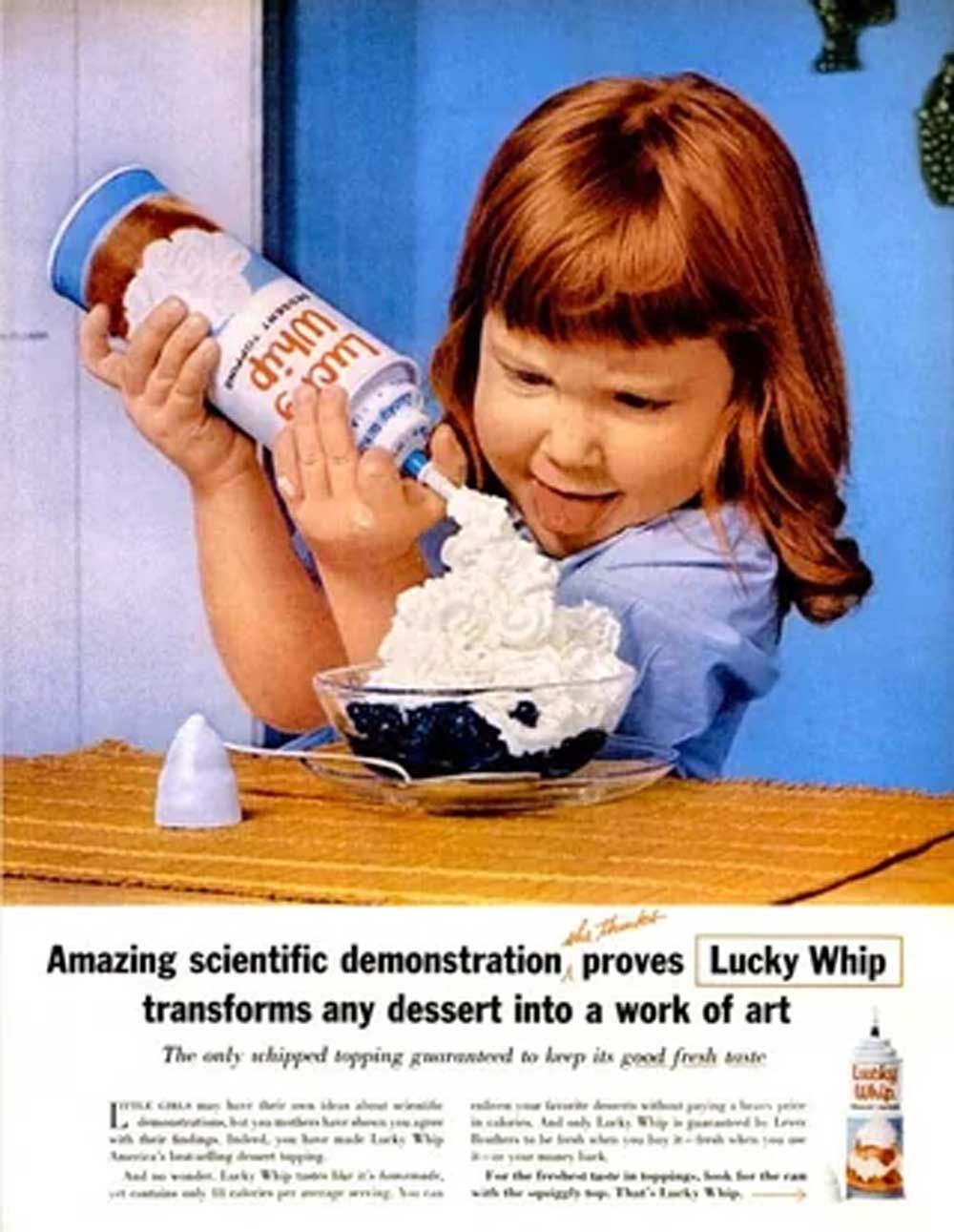A young girl joyfully sprays a large amount of whipped cream from a Lucky Whip can onto a bowl of dessert, with text below advertising Lucky Whip as the topping that transforms any dessert into a work of art.