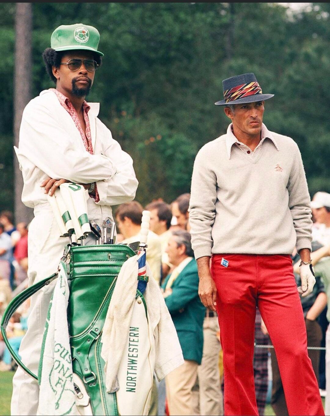 chi chi rodriguez with his caddy at the masters in 1975