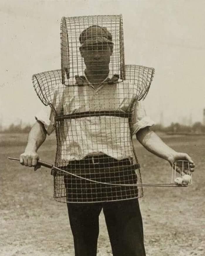 man wearing a caged suit to collect stray golf balls