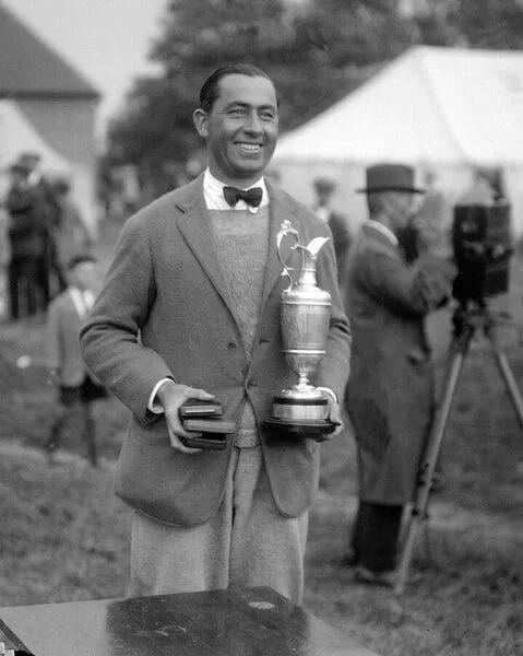 walter hagen holding a trophy