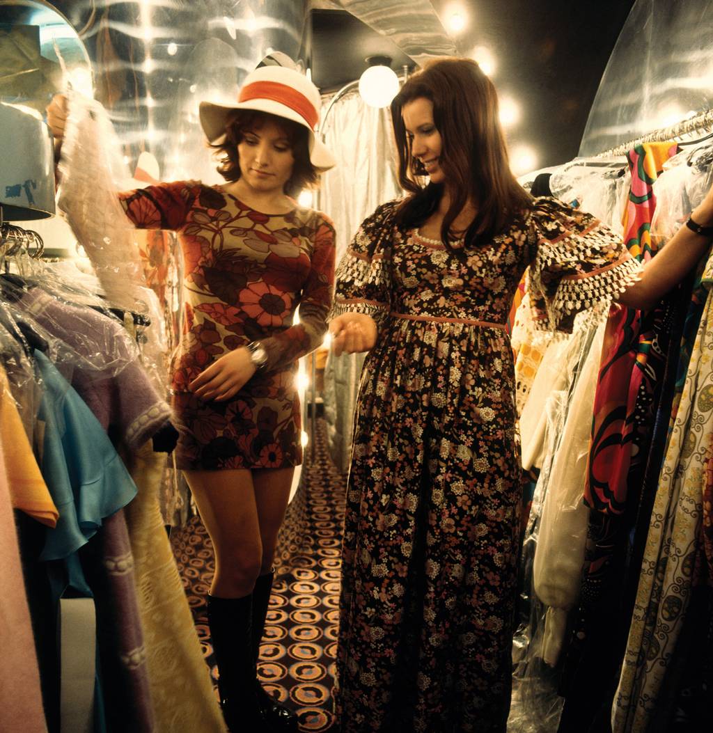 two women shopping for dresses in london in the 1970s