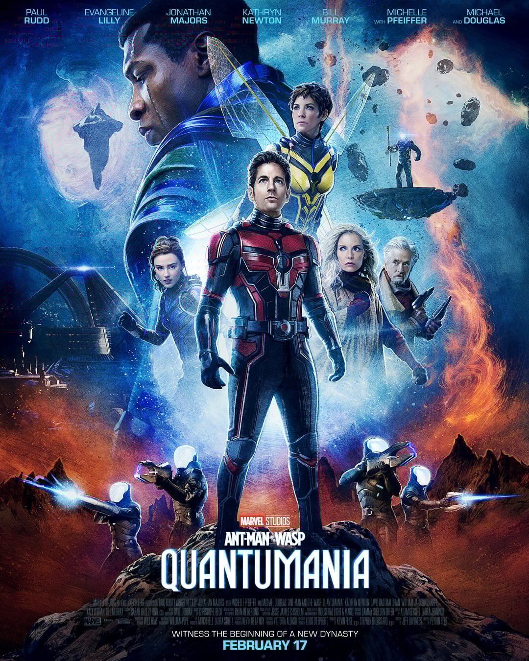 A movie poster for "Ant-Man and the Wasp: Quantumania" shows the main characters in superhero suits against a cosmic, sci-fi background with spaceships, glowing blue orbs, and rocky terrain. The release date is February 17.