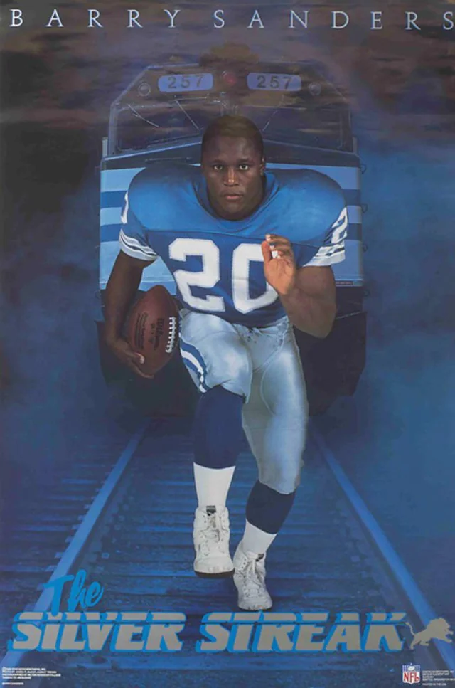 A football player in a blue and white uniform with the number 20 runs forward holding a football. A train is behind him, and the text reads "Barry Sanders" at the top and "The Silver Streak" at the bottom.