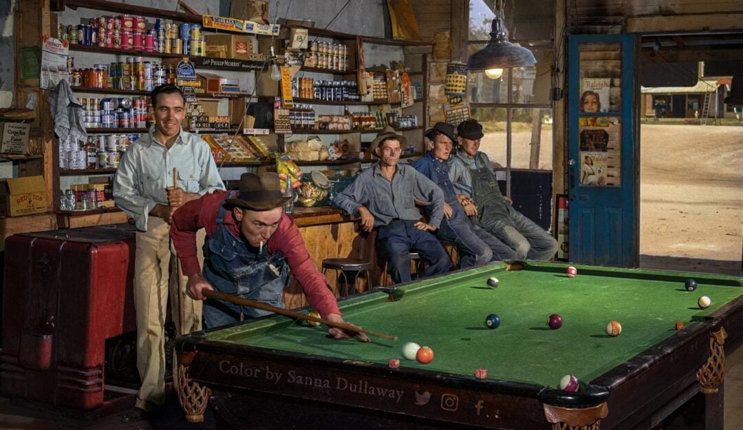 A group of men playing pool
