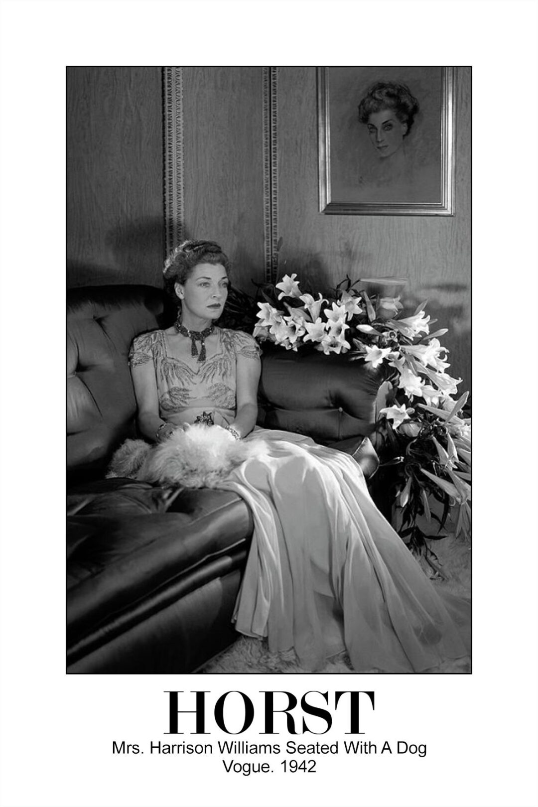 Black-and-white photo of Mrs. Harrison Williams in an elegant gown, seated on a sofa with a small fluffy dog and white lilies, beneath a framed portrait. Text below reads: “HORST Mrs. Harrison Williams Seated With A Dog Vogue. 1942.”