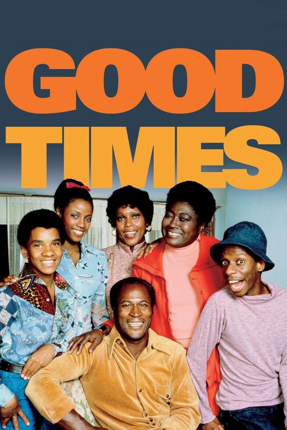 A cheerful group of six people, including three women and three men, pose closely together and smile beneath large orange text that reads "GOOD TIMES" against a blue background.