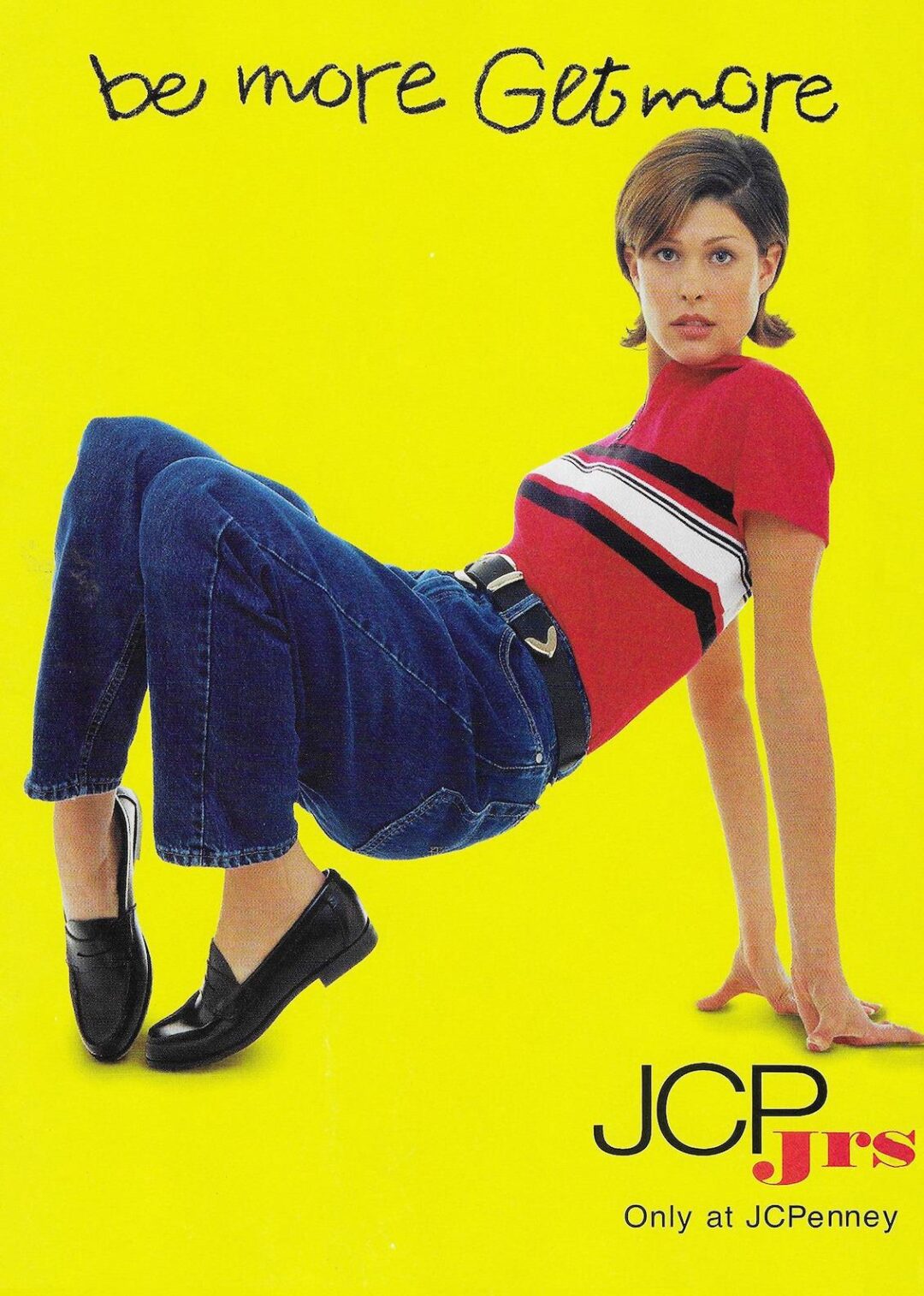 A young woman in a red, white, and black striped top and jeans reclines against a bright yellow background with the text “be more Get more” and “JCP Jrs Only at JCPenney” in the corner.